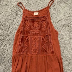 A flowy  orange halter top